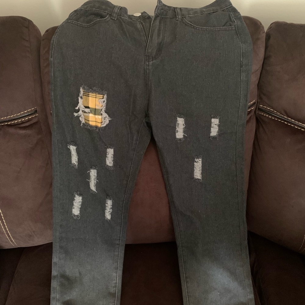 New, never worn “slim fit” jeans. It has a bleached & ripped design